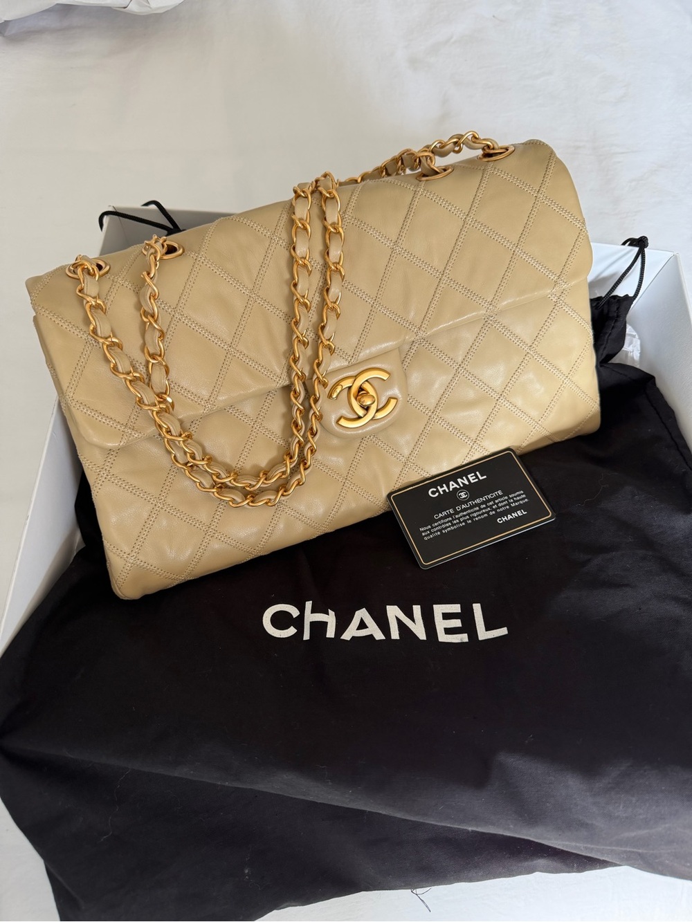 CHANEL Diamond Stitch Lambskin Single Flap Beige with Antiqued Gold Hardware.